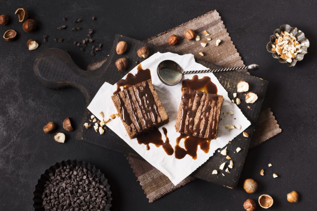 This slutty brownies recipe layers rich chocolate chip cookie dough, a center of Oreo cookies, and a fudgy brownie topping.